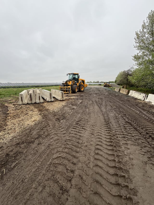 Large-scale site preparation using heavy equipment for solar field development